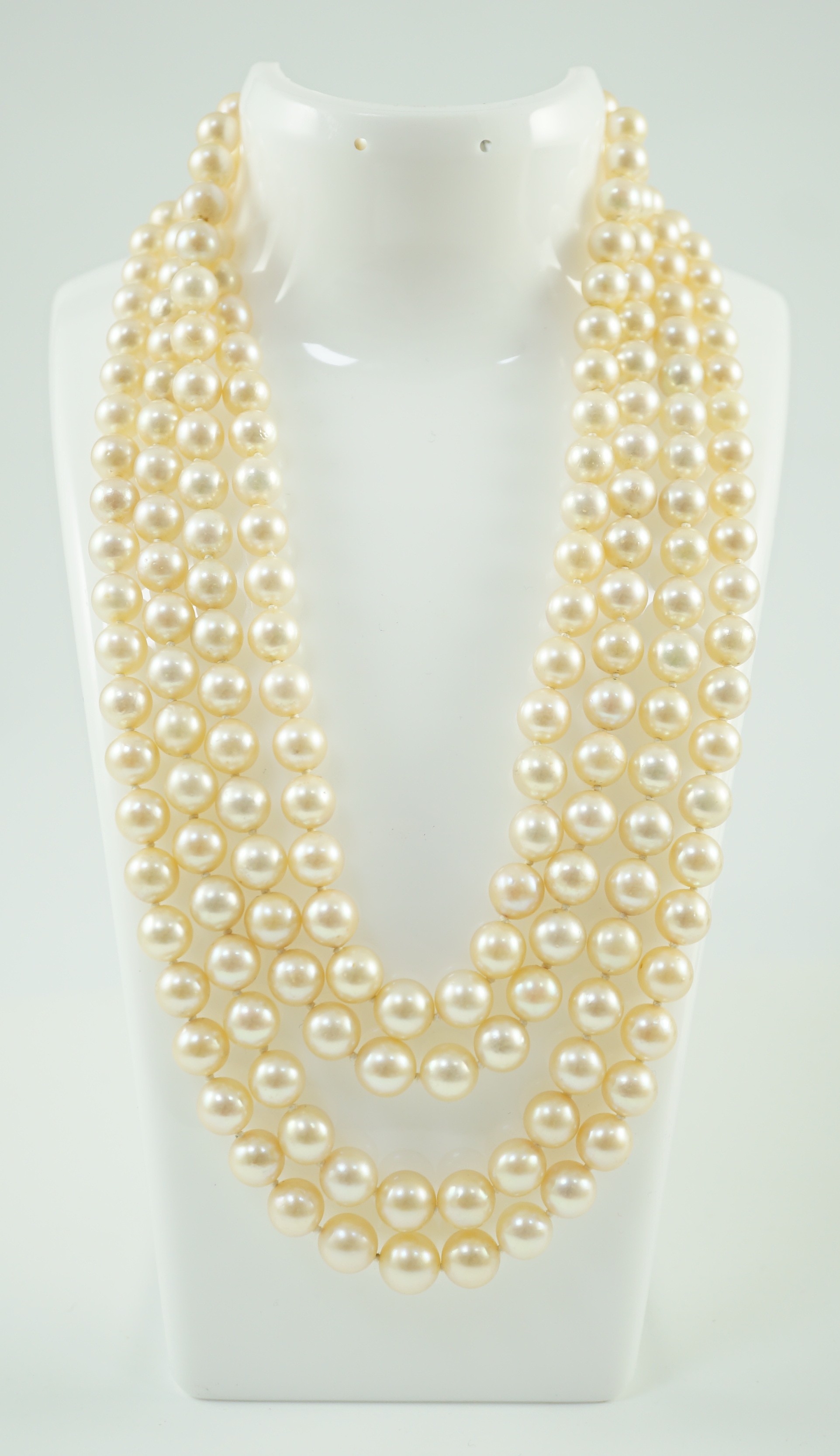 A mid to late 20th century continental quadruple strand cultured pearl necklace, with white gold and diamond cluster set flower head clasp